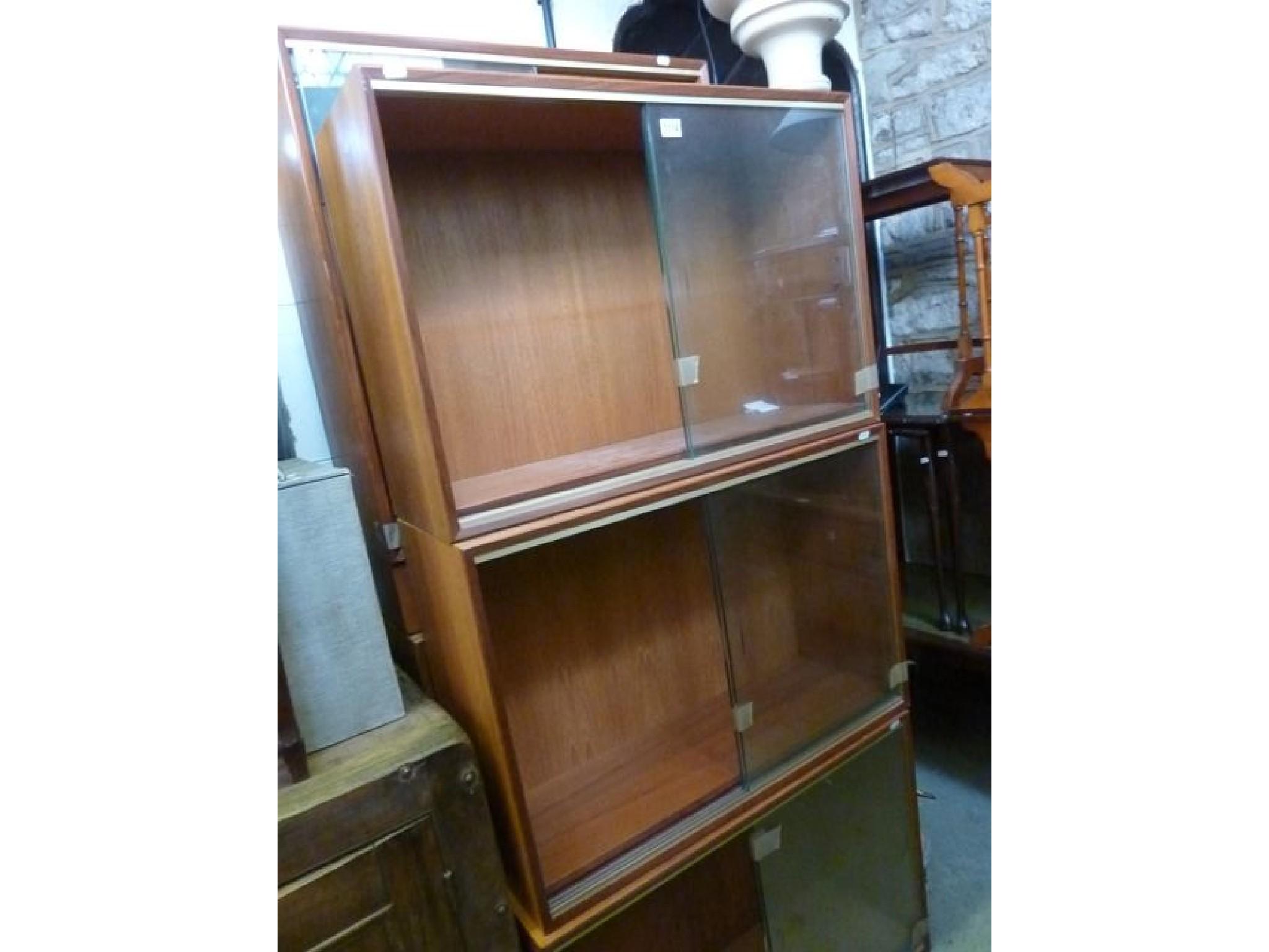 Appraisal: Five Minty library bookcases in teak of varying size each