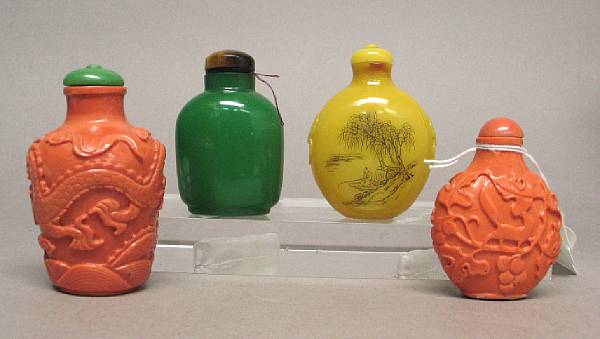 Appraisal: Four glass snuff bottles The first of opaque green glass