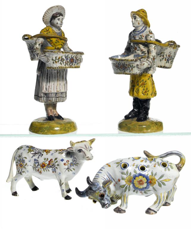 Appraisal: A PAIR OF DUTCH DELFTWARE POLYCHROME FIGURES OF A FISHERMAN