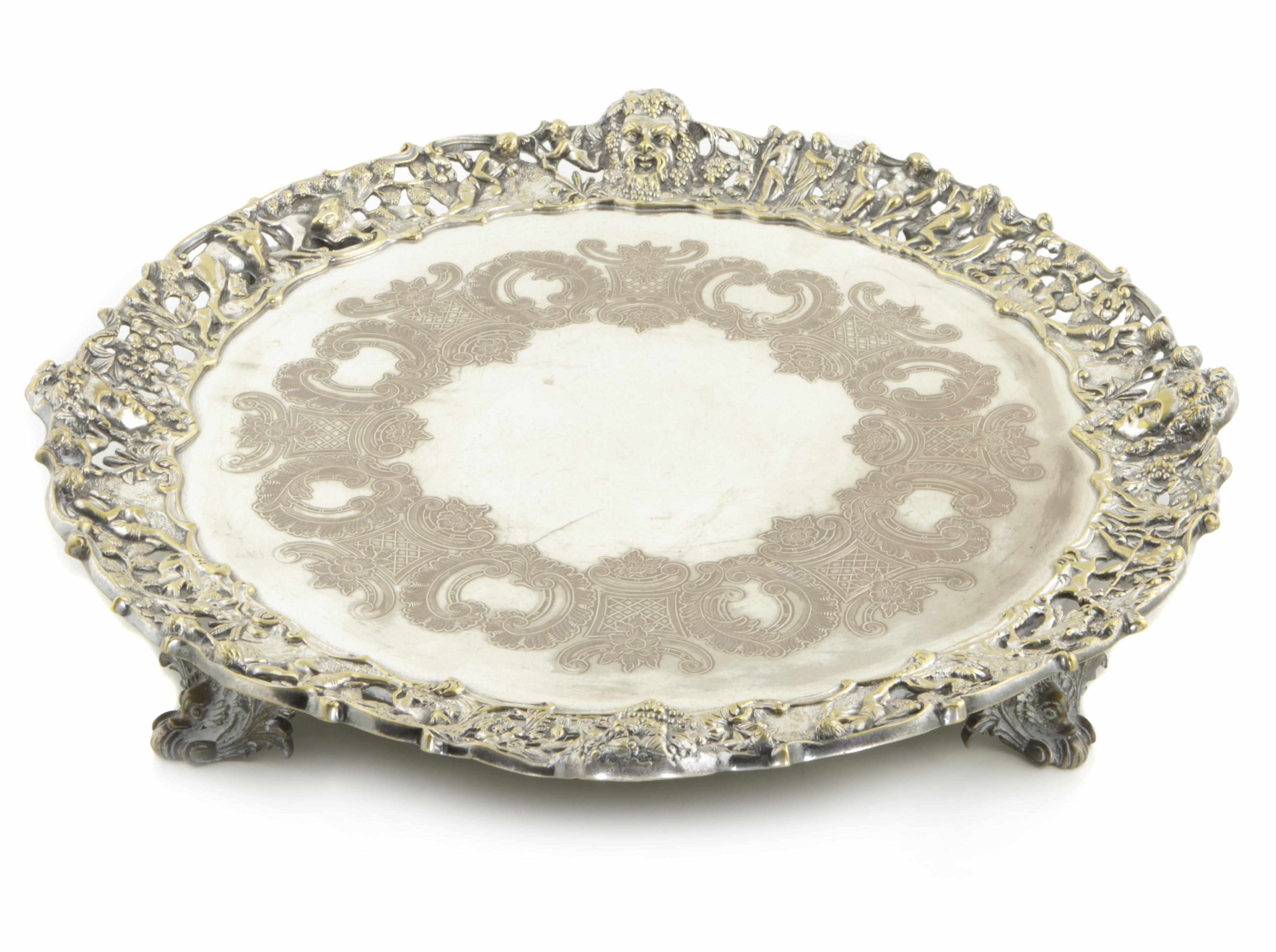 Appraisal: A plated circular tray with cast border and supports Of