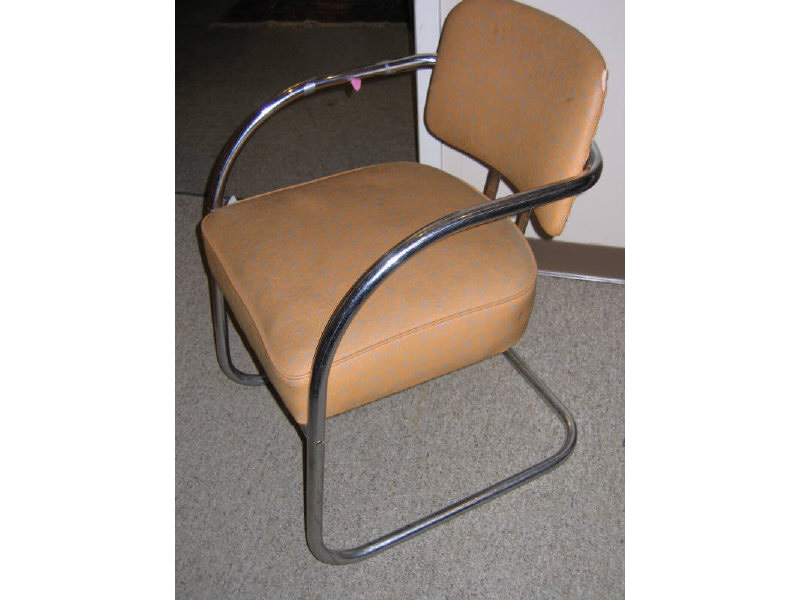 Appraisal: PAIR OF AMERICAN CHROMED TUBULAR ARMCHAIRS of tub-form with vinyl