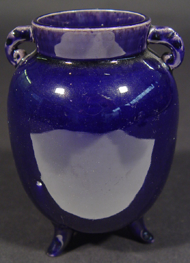 Appraisal: Chinese purple glazed pot with elephants head handles cm high