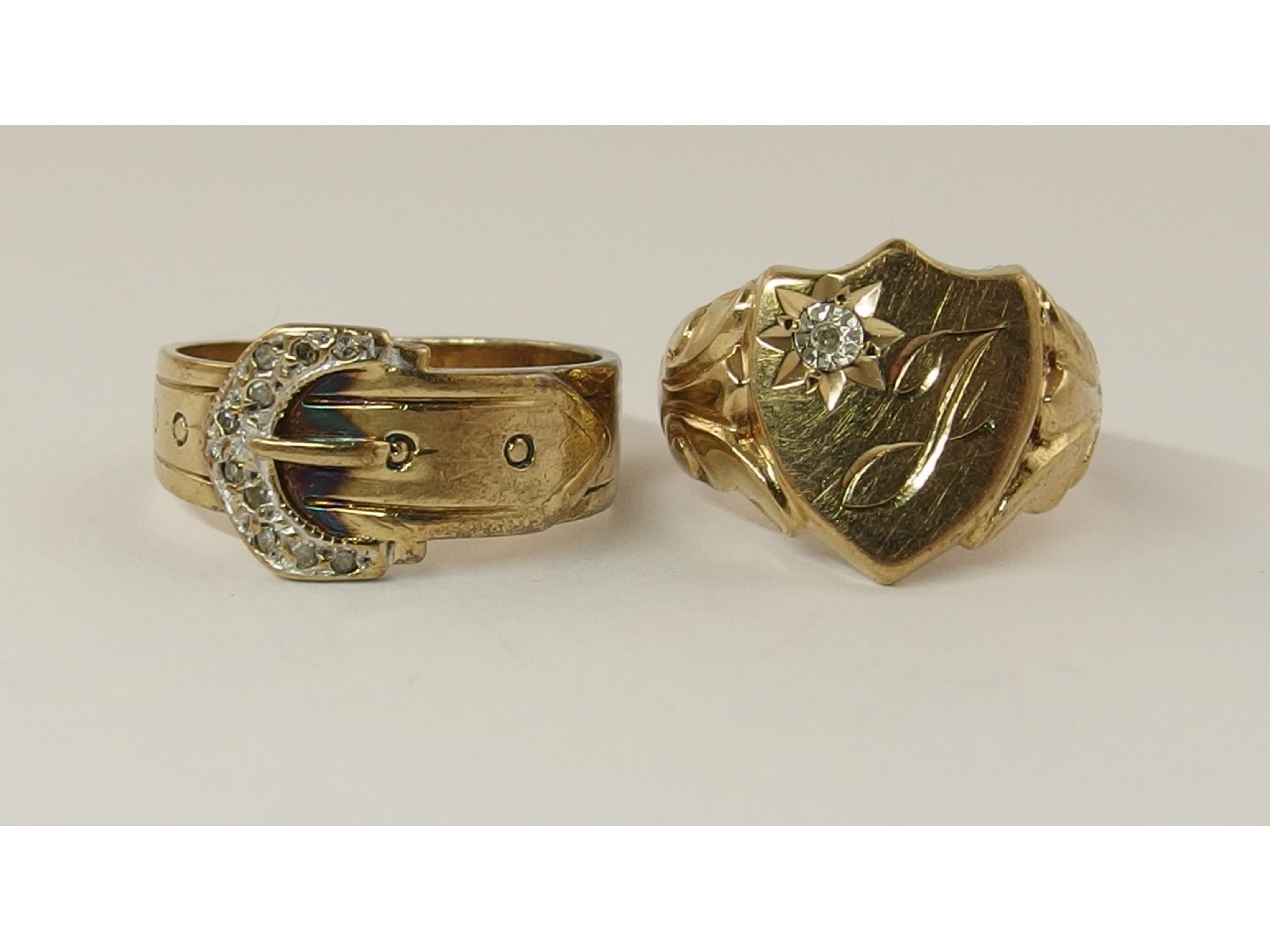 Appraisal: A ct buckle ring dated and a diamond set signet