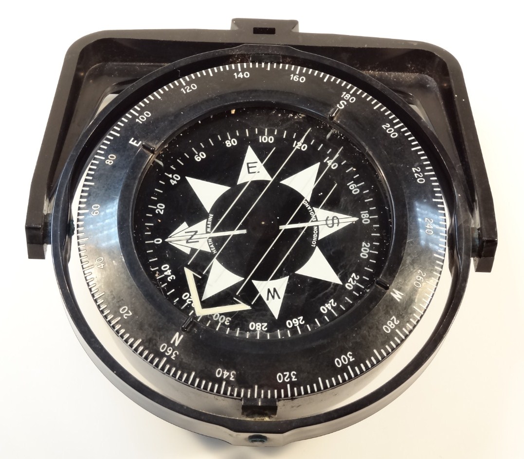 Appraisal: A thC cased heavy duty ship's compass the circular dial