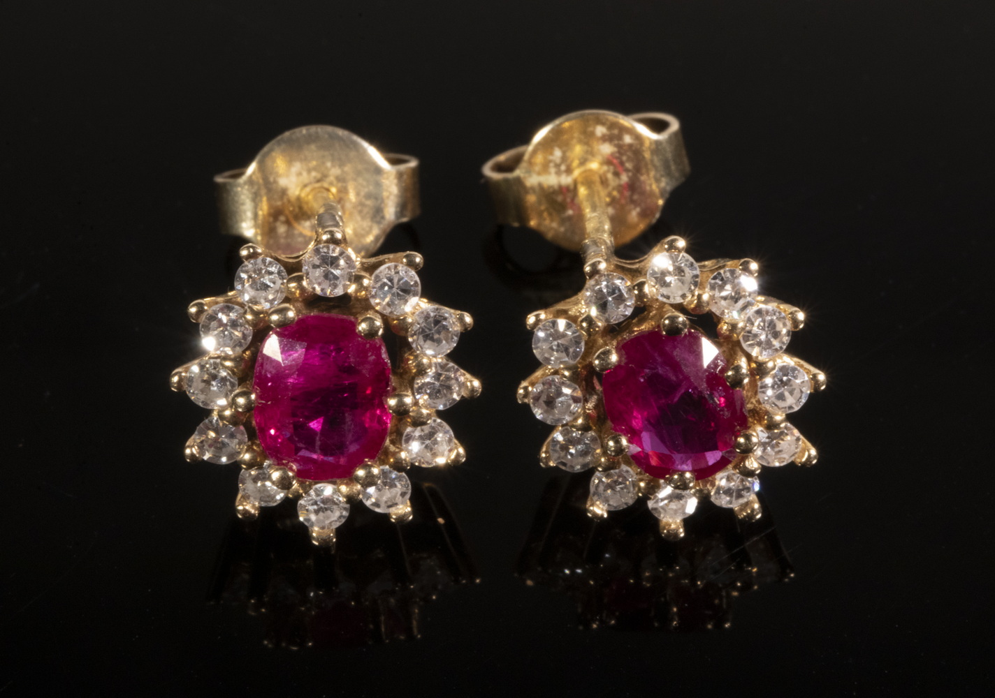 Appraisal: PAIR OF RUBY AND DIAMOND EARRINGS Stud earrings each set