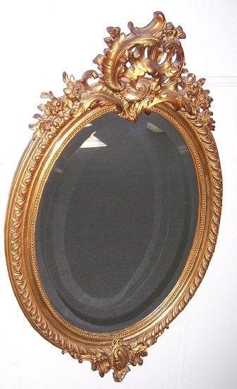 Appraisal: An th Century style mirror the oval bevelled glass within