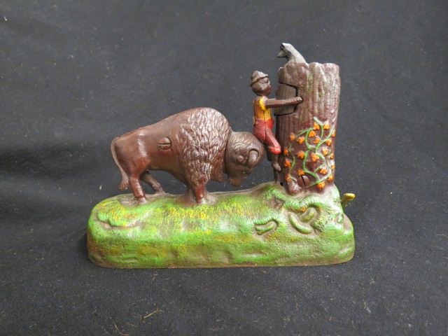 Appraisal: Cast Iron Mechanical Bank black boy with buffalo bear Book