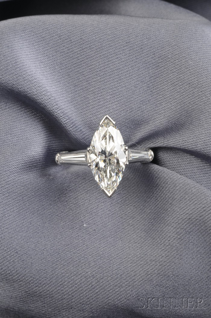 Appraisal: Platinum and Diamond Solitaire prong-set with a marquise-cut diamond weighing