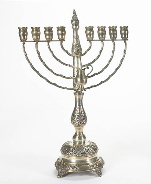 Appraisal: A sterling menorah after the antique The body chased with