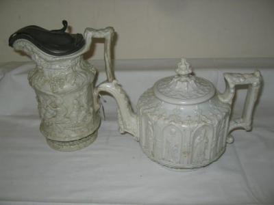 Appraisal: A VICTORIAN RELIEF MOULDED TEAPOT of circular form moulded with