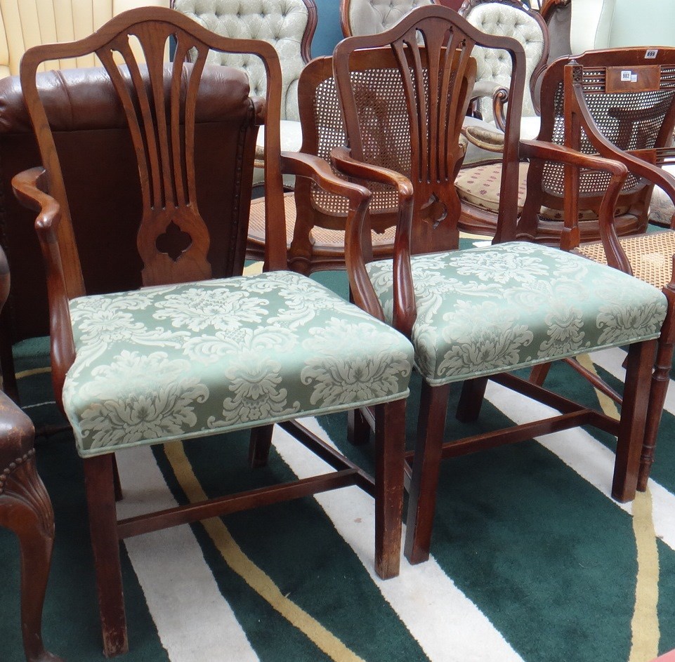 Appraisal: A pair of George III elm open armchairs with straight