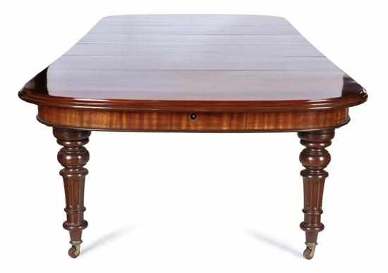 Appraisal: A GOOD QUALITY VICTORIAN MAHOGANY EXTENSION DINING TABLE The rounded