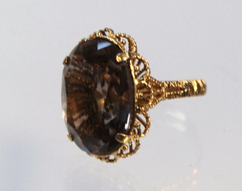 Appraisal: A ladies dress ring with oval claw set smoky quartz