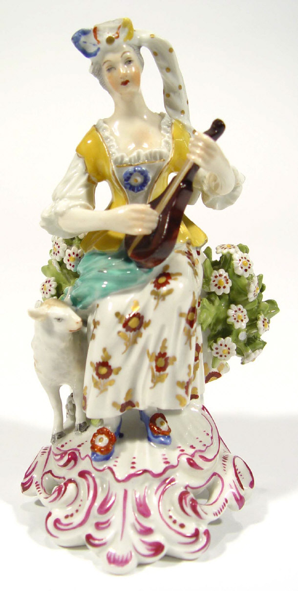 Appraisal: Hand painted Continental pottery figure of a woman playing the