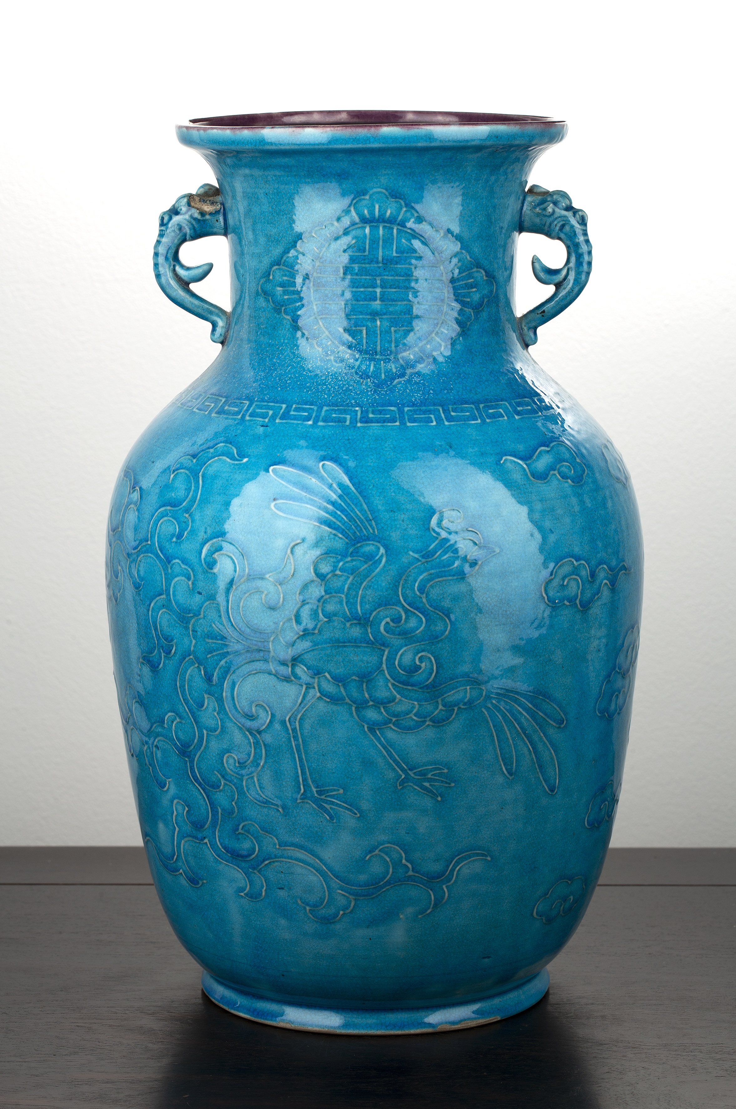 Appraisal: Blue ground porcelain vaseChinese th Century with raised phoenix and