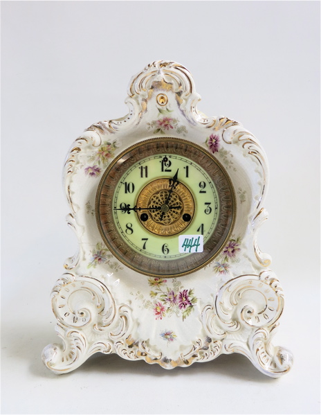 Appraisal: WATERBURY CHINA MANTLE CLOCK with white glaze and floral affectation