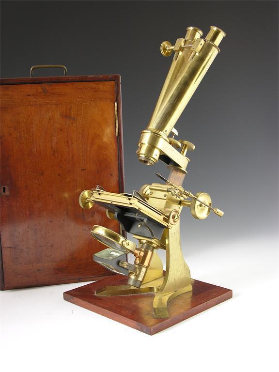 Appraisal: A large brass binocular compound microscope