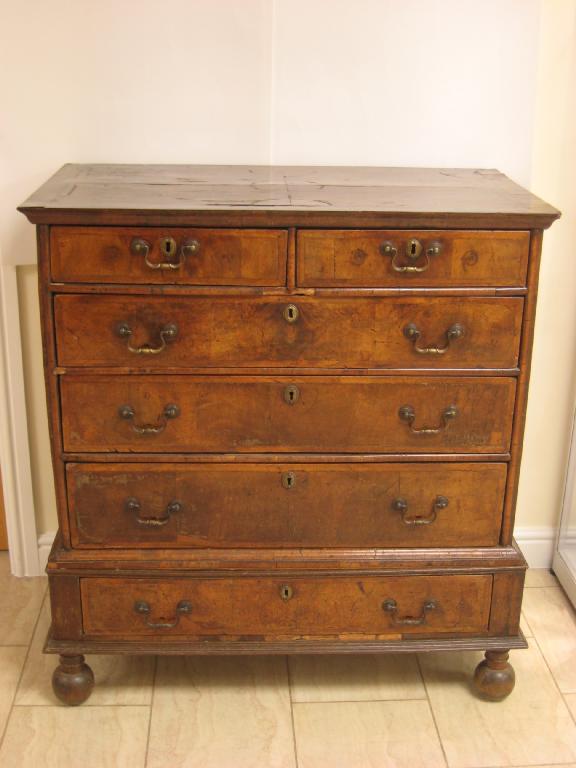 Appraisal: An th Century walnut Chest having satinwood inlays to the