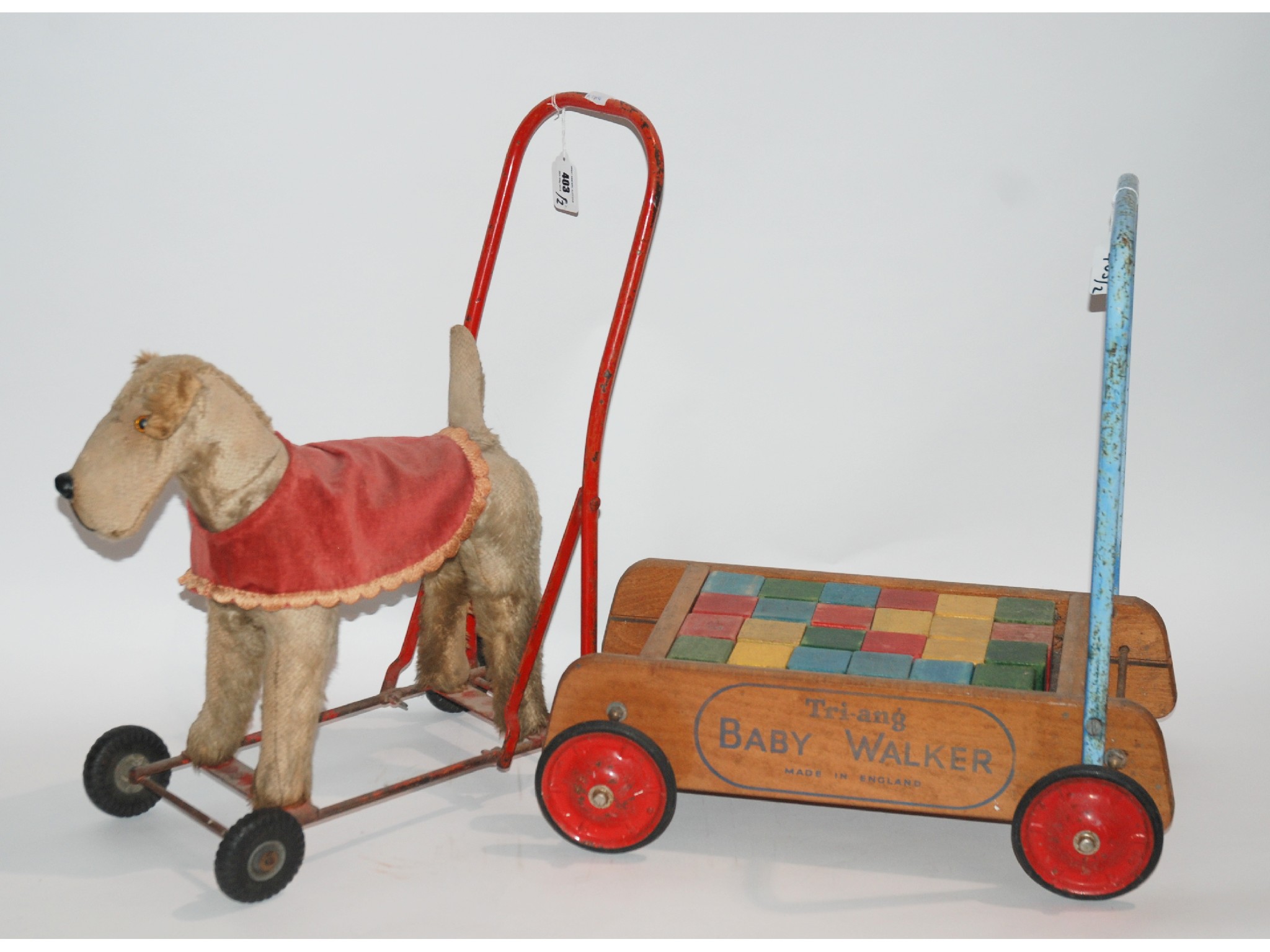 Appraisal: A Line Brothers Push-A-Long terrier and a Tri-ang baby walker