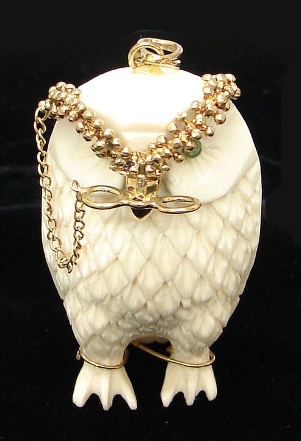 Appraisal: Ivory figure with jeweled eyes and gold crown and eyeglasses