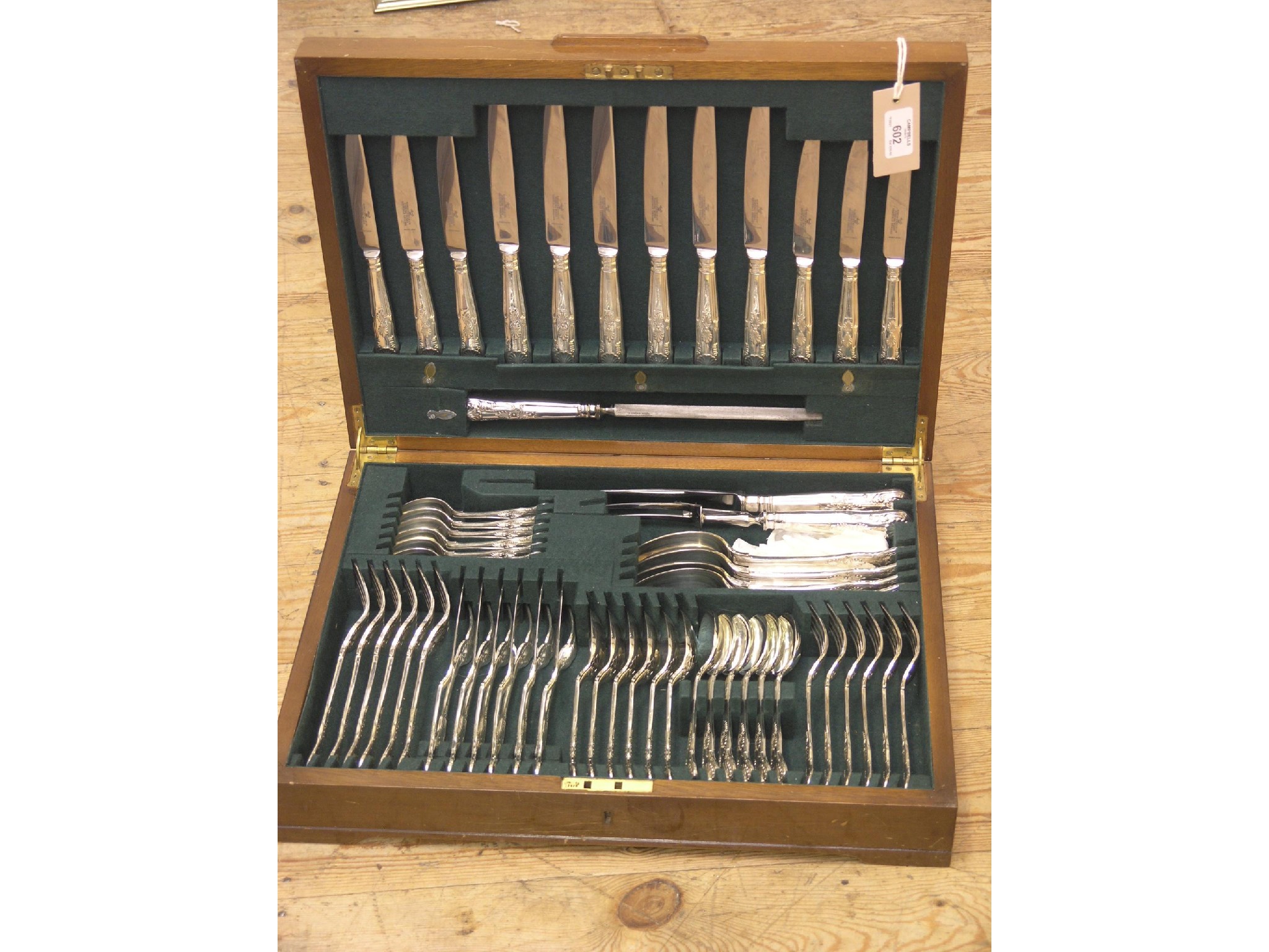 Appraisal: A walnut canteen of silver plated cutlery Queens pattern sixty