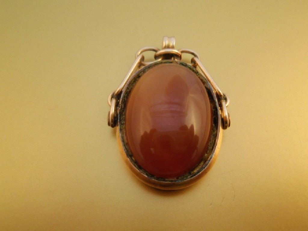 Appraisal: A double sided agate swivel fob seal ct gold mount