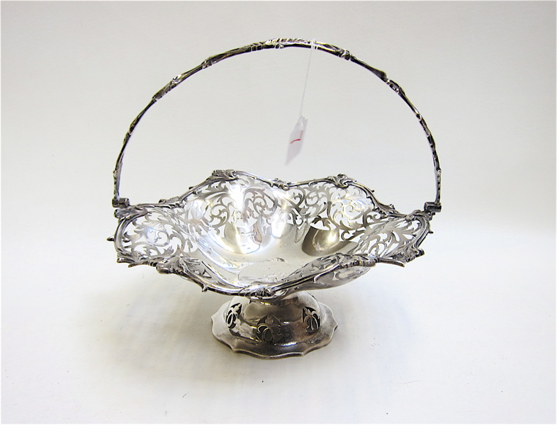 Appraisal: ENGLISH STERLING SILVER BASKET having pierced sides ruffled rim bale