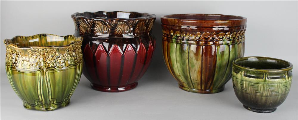 Appraisal: FOUR ART POTTERY JARDINIERES one with flared wave molded lip