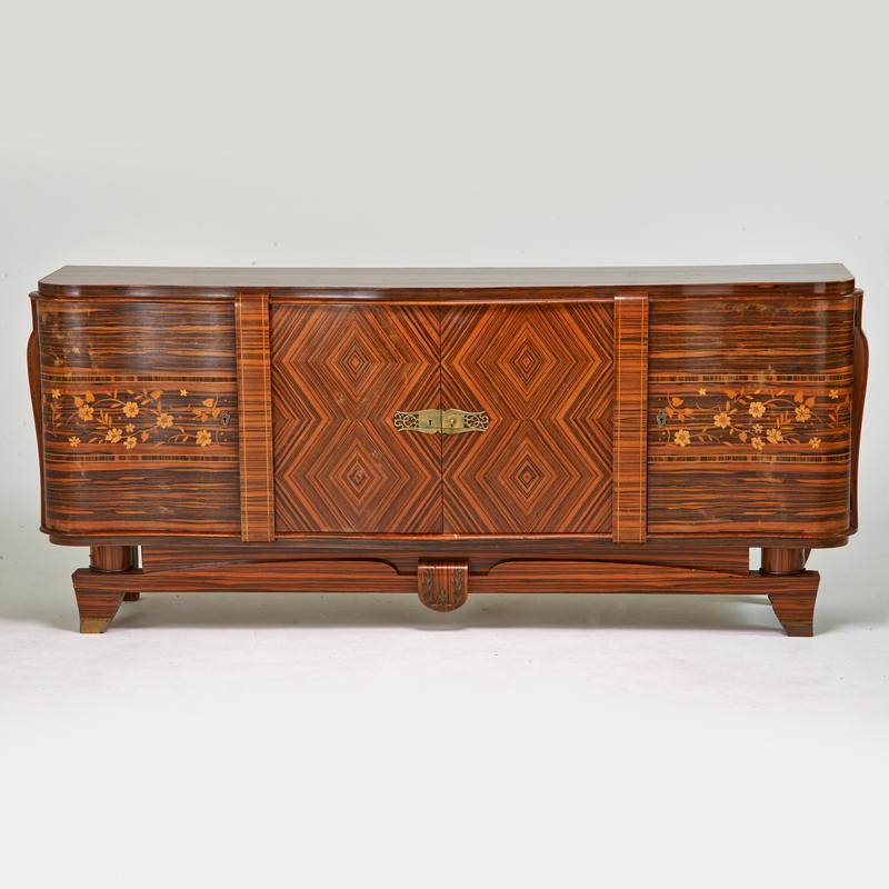 Appraisal: STYLE OF JEAN ROYERE Sideboard France s Mixed exotic woods