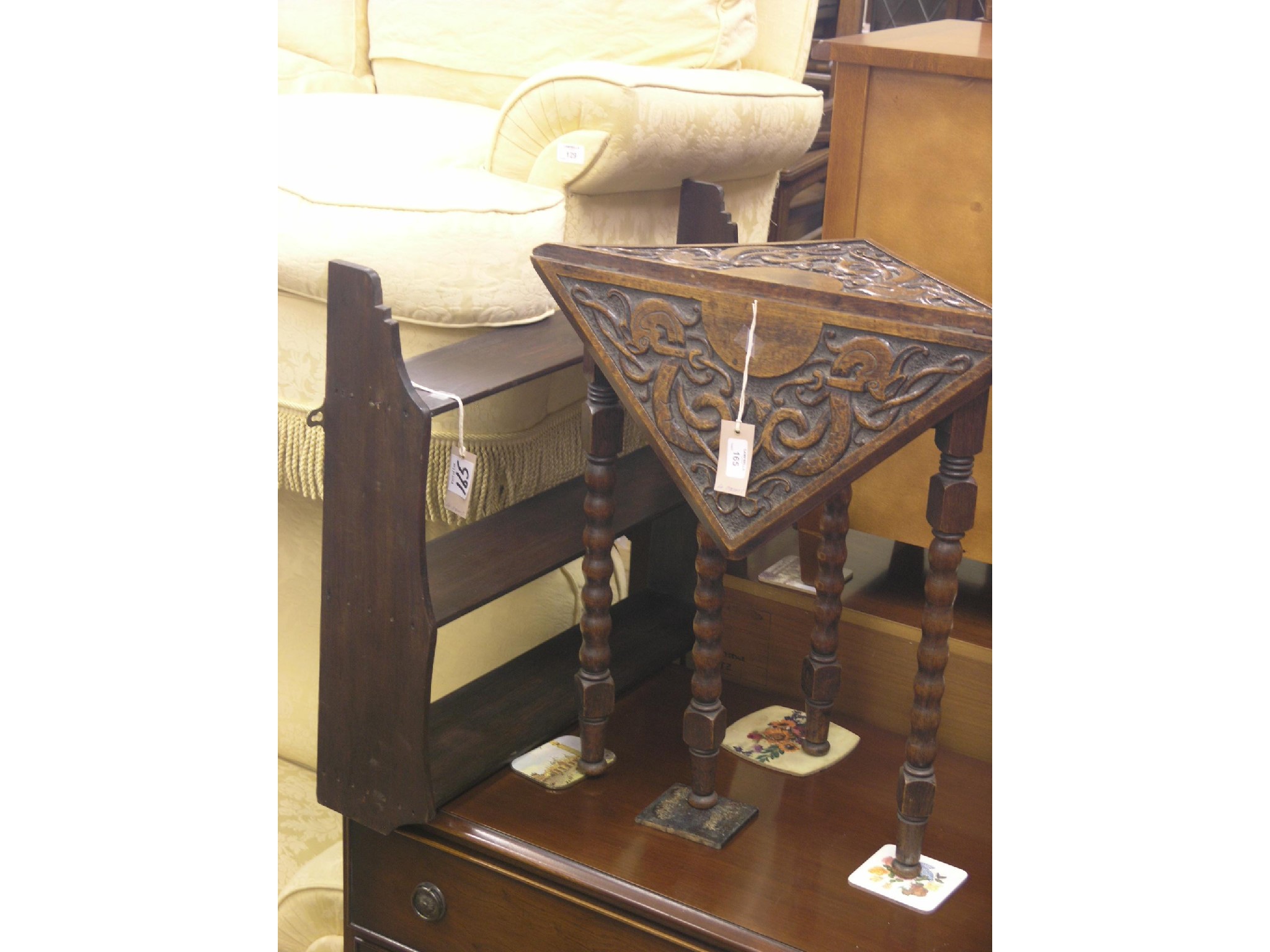 Appraisal: A late Victorian carved oak side table folding top on