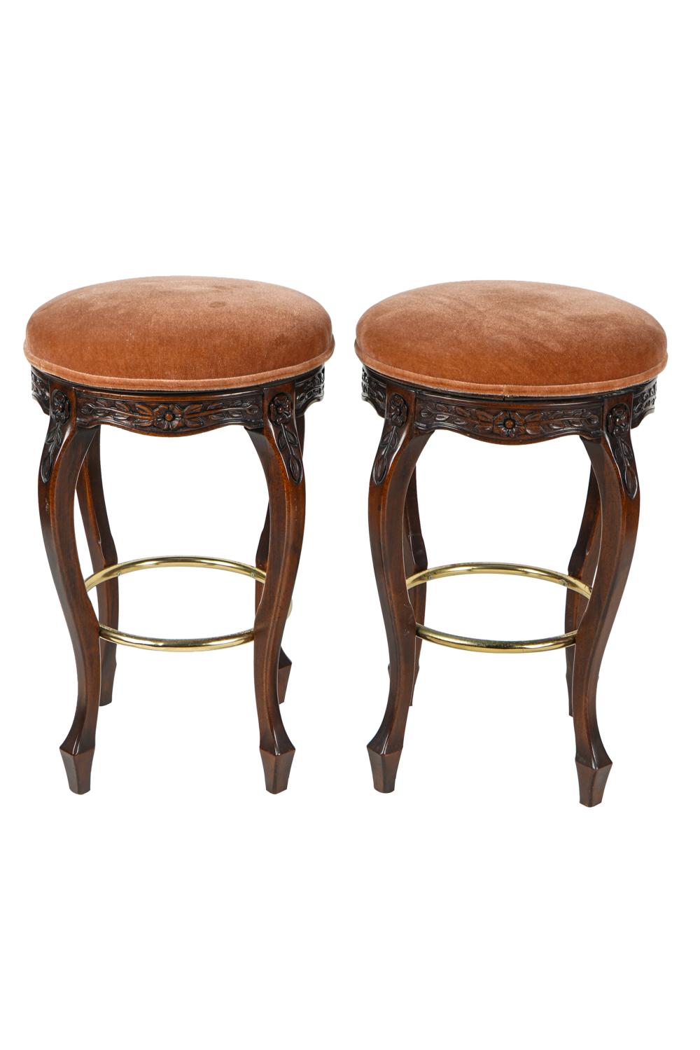 Appraisal: PAIR OF PROVINCIAL STYLE OAK BAR STOOLSeach with round rust-colored