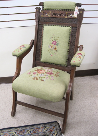 Appraisal: VICTORIAN FOLDING ARMCHAIR Eastlake design American c with green floral