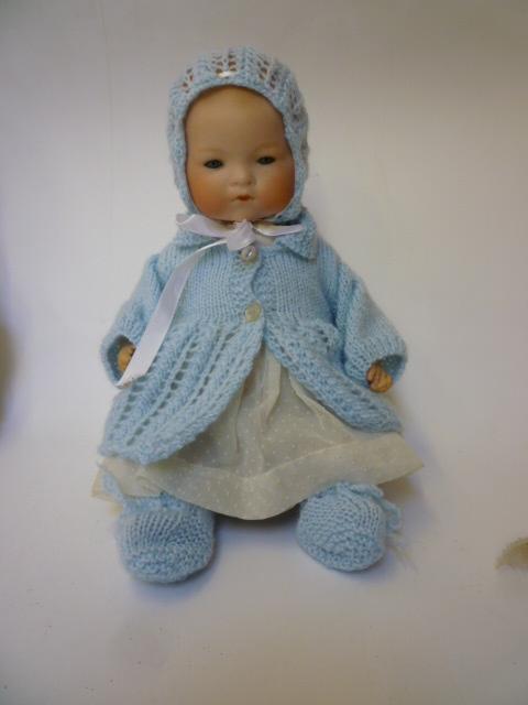 Appraisal: An Armand Marseille bisque head baby doll with blue glass