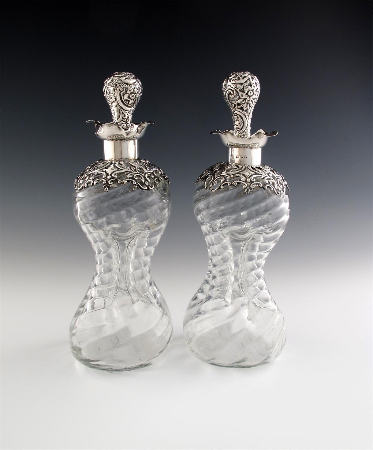 Appraisal: A pair of late-Victorian silver mounted decanters