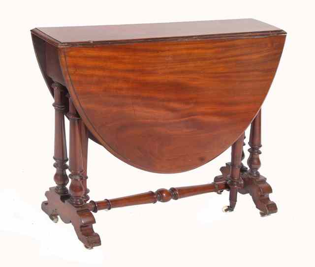 Appraisal: A VICTORIAN MAHOGANY SUTHERLAND TABLE standing on turned supports and