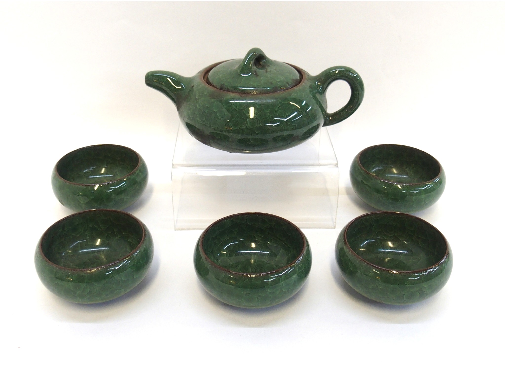 Appraisal: Green crackle glaze saki set