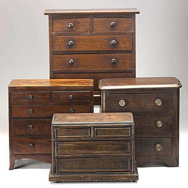 Appraisal: FOUR ENGLISH MINIATURE CHESTSTwo over three drawer with French feet