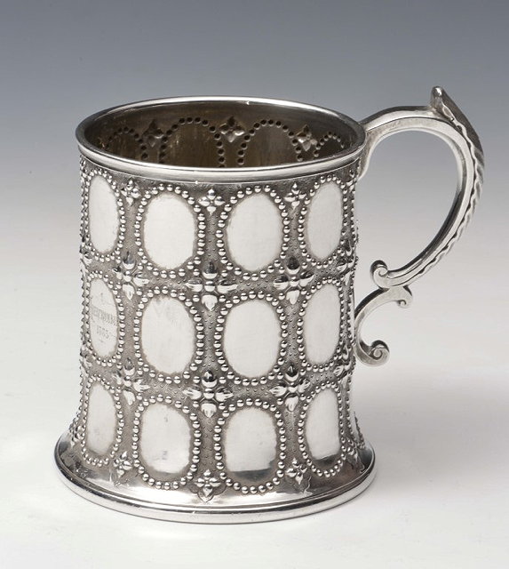 Appraisal: A VICTORIAN SILVER CHRISTENING MUG decorated with oval beaded panels