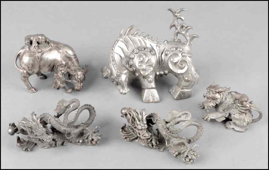 Appraisal: PAIR OF CHINESE SILVERED BRONZE DRAGONS Together with four Chinese