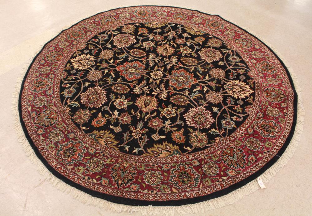 Appraisal: ROUND ORIENTAL CARPET Indo-Persian floral pattern on midnight blue ground