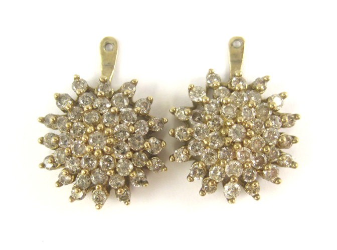 Appraisal: PAIR OF DIAMOND EARRING ENHANCERS each k yellow gold set