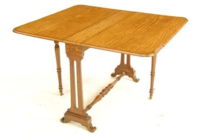 Appraisal: A th century satinwood Sutherland table on open trestle end