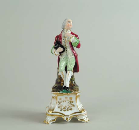 Appraisal: OLD PARIS GENTLEMAN FIGURINE Colonial dressed man with red coat