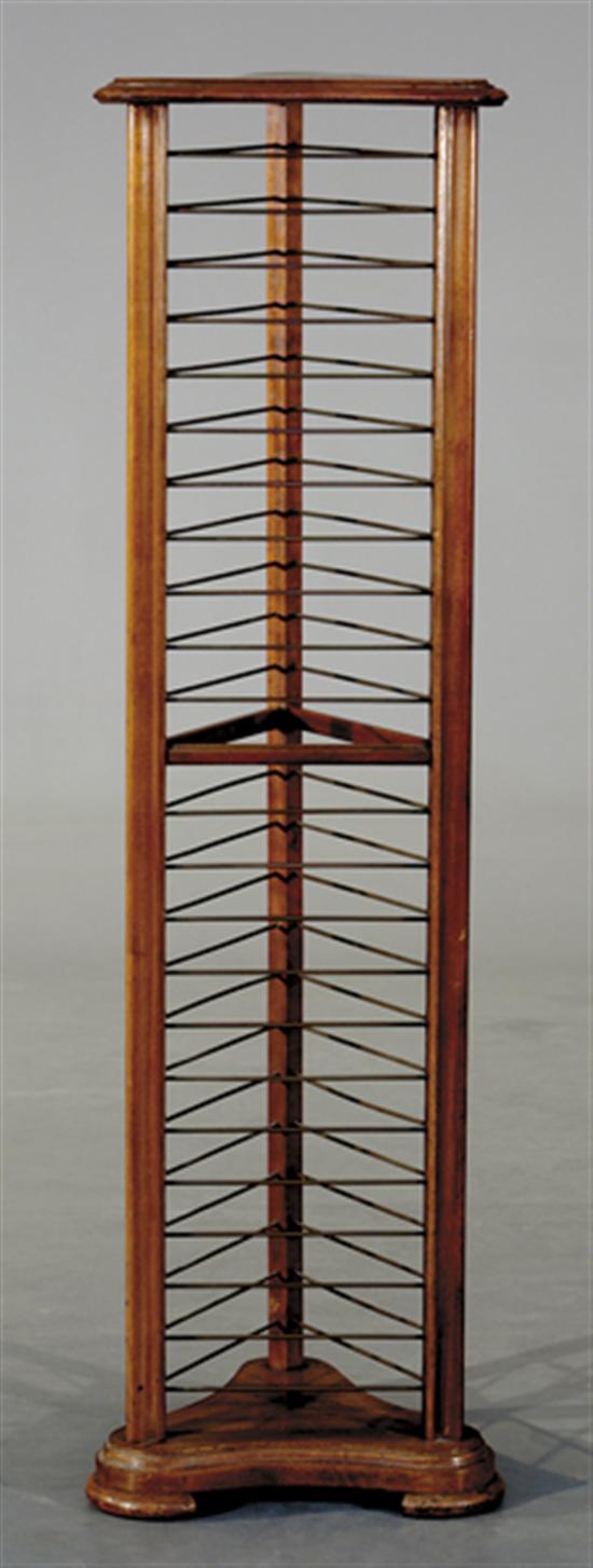 Appraisal: Walnut and brass plate rack molded triangular top over three