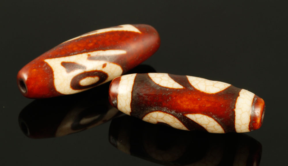 Appraisal: - Chinese Agate Beads Two Chinese beads agate dia Provenance