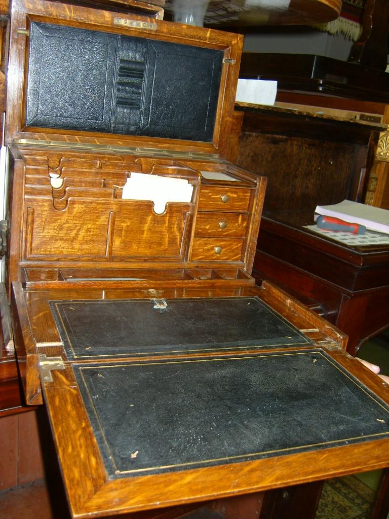 Appraisal: An Edwardian oak stationery cabinet with rising lid the fall