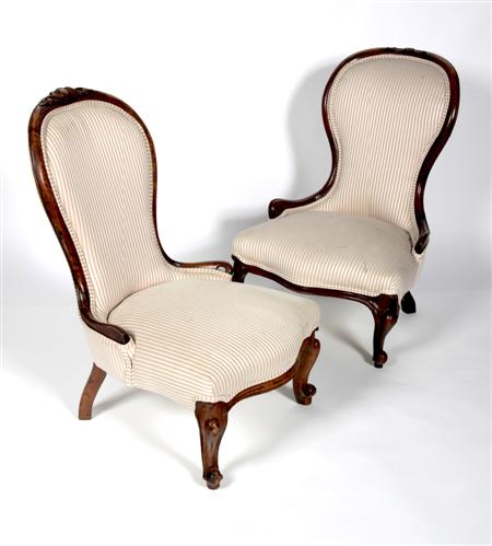 Appraisal: A near pair of Victorian walnut nursing chairs each with