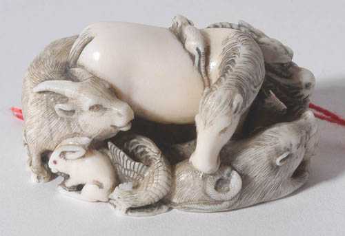 Appraisal: NETSUKE Japan Meiji Period L cm Ivory partially blackened The