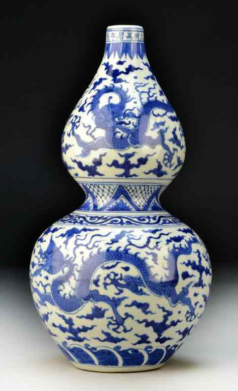 Appraisal: Chinese Blue White Double Gourd VaseFinely painted to depict five-clawed