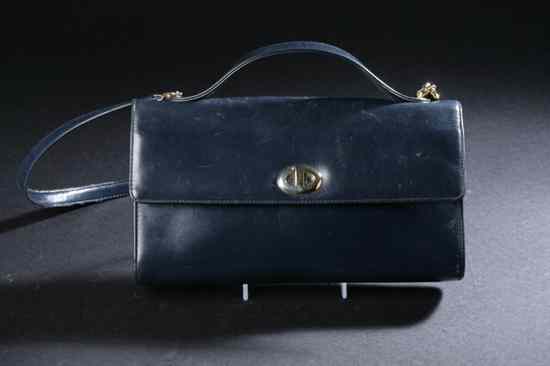 Appraisal: CHRISTIAN DIOR NAVY LEATHER HANDBAG Single compartment interior fitted with